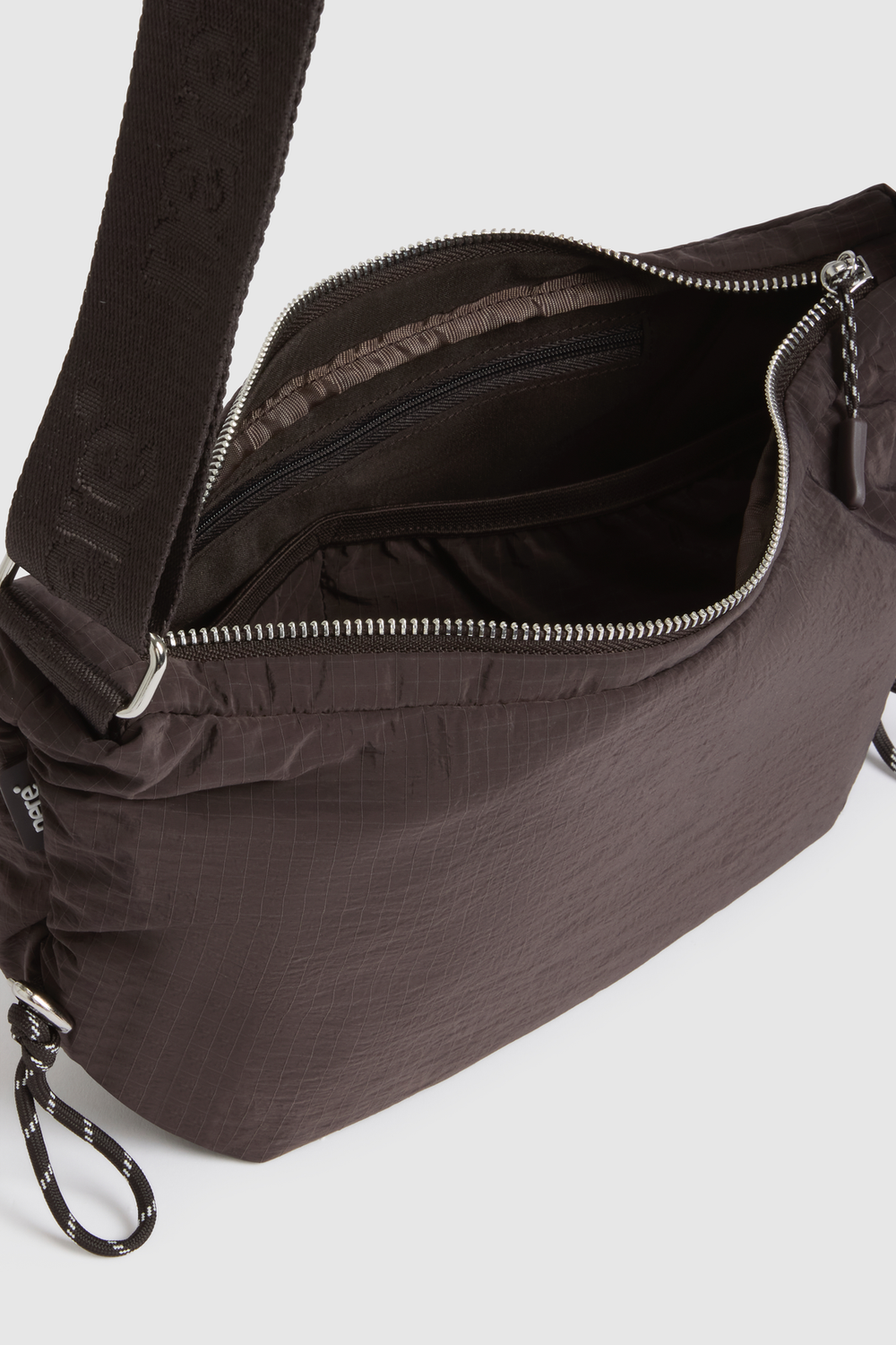 n.motion Crescent Sling Bag