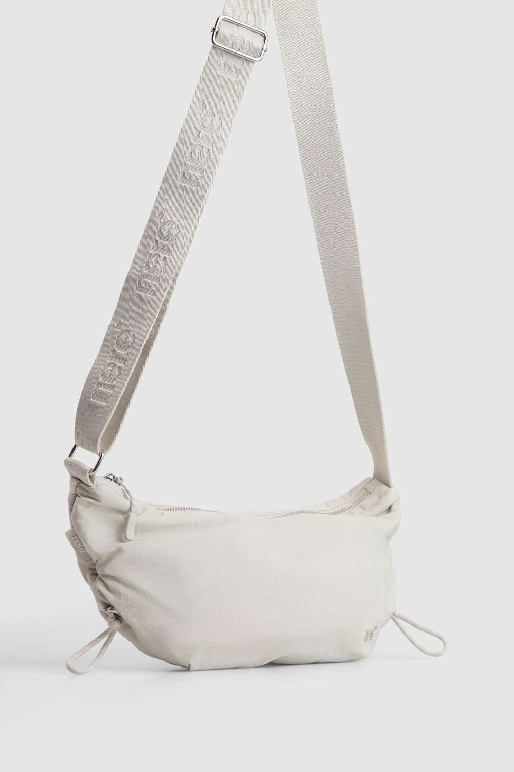 n.motion Crescent Sling Bag